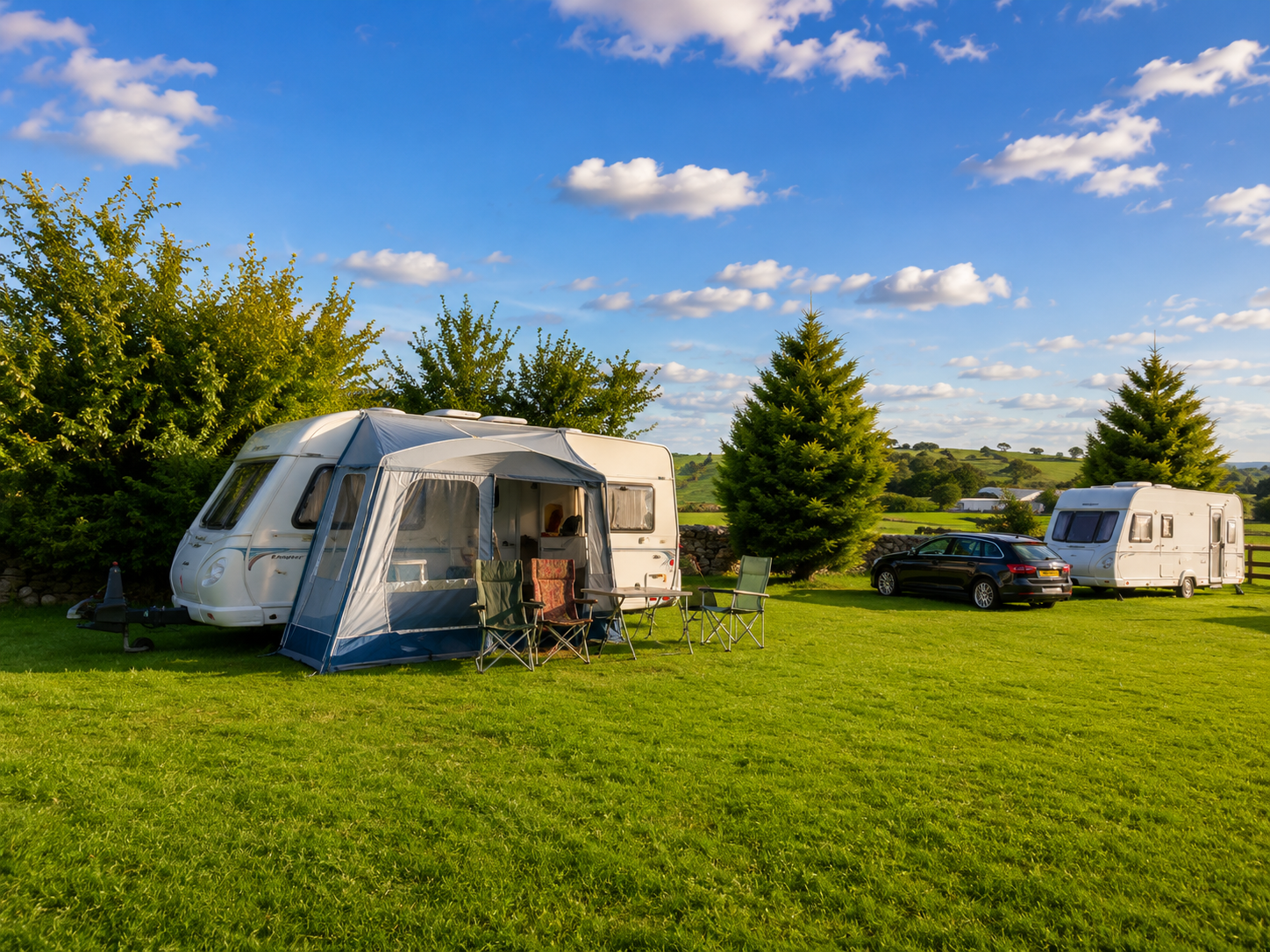 Caravans on the grass touring field at Collierhall Farm